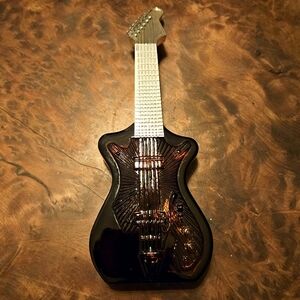 AVON Guitar Decanter Filled w wild Country After Shave.